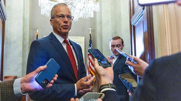 Senate Majority Leader John Thune responds to a question from the news media as he walks to his office in the Capitol in Washington, June 5, 2025. 