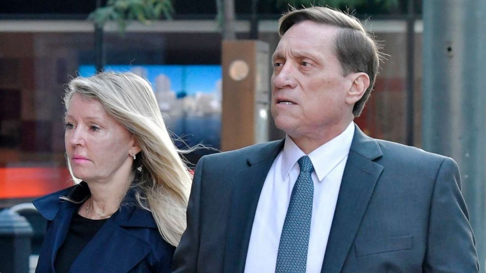 PHOTO: John Wilson and his wife arrive at federal court, Oct. 7, 2021, in Boston. Lawyers gave closing arguments in the case against Gamal Abdelaziz and John Wilson, who are accused of paying bribes to get their kids into college.