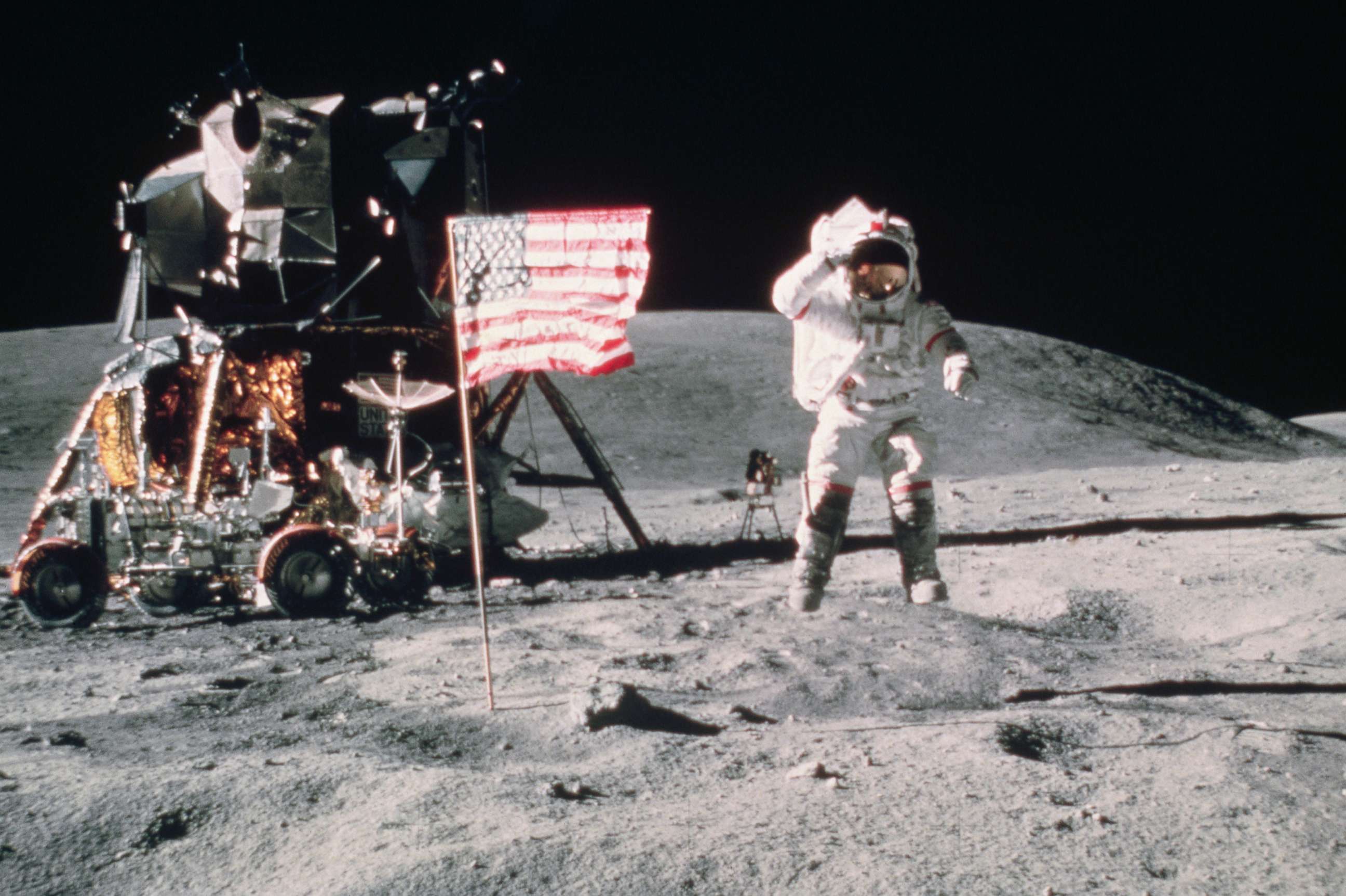 PHOTO: John W. Young, Commander of Apollo 16 moon mission, salutes the United States flag as he leaps from the lunar surface near the lunar lander in this undated file photo. 