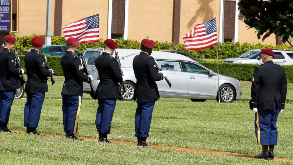 PHOTO: An honor guard stands at attention as a hearse carries the coffin of U.S. Army Sergeant La David Johnson, who was among four special forces soldiers killed in Niger, to a graveside service in Hollywood, Fla., Oct. 21, 2017.