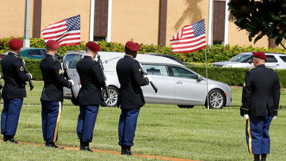 PHOTO: An honor guard stands at attention as a hearse carries the coffin of U.S. Army Sergeant La David Johnson, who was among four special forces soldiers killed in Niger, to a graveside service in Hollywood, Fla., Oct. 21, 2017.