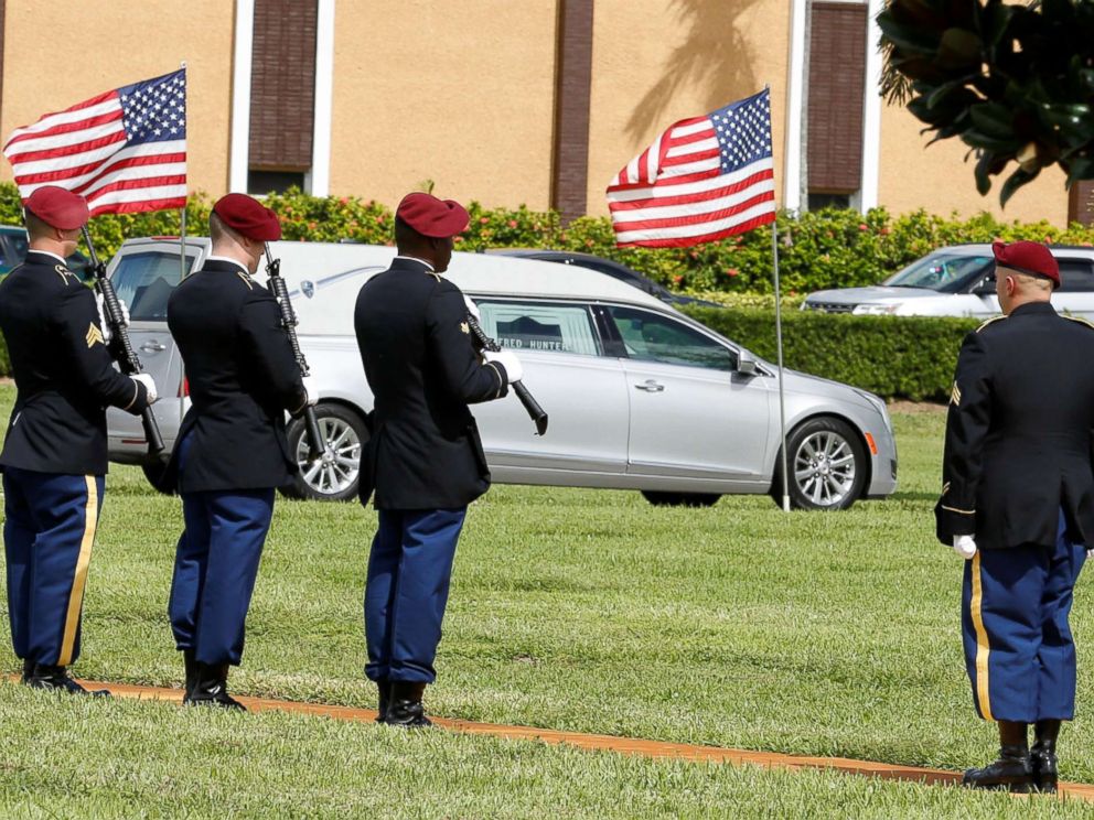 PHOTO: An honor guard stands at attention as a hearse carries the coffin of U.S. Army Sergeant La David Johnson, who was among four special forces soldiers killed in Niger, to a graveside service in Hollywood, Fla., Oct. 21, 2017.