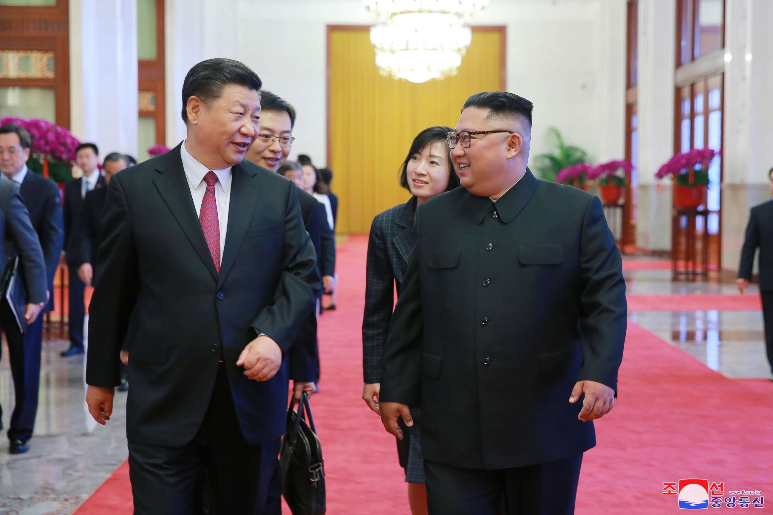 PHOTO: A photo released by the official North Korean Central News Agency (KCNA) shows North Korean leader Kim Jong-un walking with Chinese President Xi Jinping during their meeting in Beijing, China, June 19, 2018.