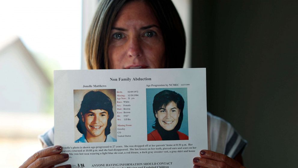 PHOTO: Jennifer Mogensen holds a poster of her adopted sister, Jonelle Matthews, who went missing and whose remains were found recently in Greeley, Colo., April 12, 2019.