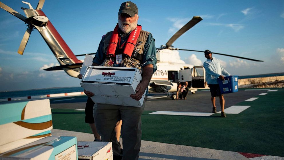 PHOTO: Chef Jose Andres carries food relief while working with his charity group World Central Kitchen to help survivors of Hurricane Dorian Sept. 5, 2019, in Marsh Harbor, Great Abaco, Bahamas.
