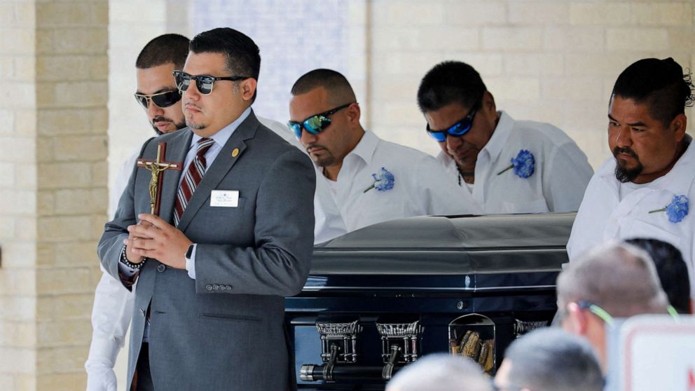 PHOTO: People carry the coffin of Jose Flores Jr, one of the victims of the Robb Elementary school mass shooting that resulted in the deaths of 19 children and two teachers, out of Sacred Heart Catholic Church, in Uvalde, Texas, June 1, 2022.