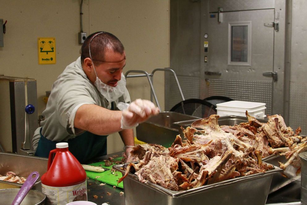 PHOTO: An inmate helps prepare the Thanksgiving dinner at Joseph Harp Correctional Center in Oklahoma in 2017.