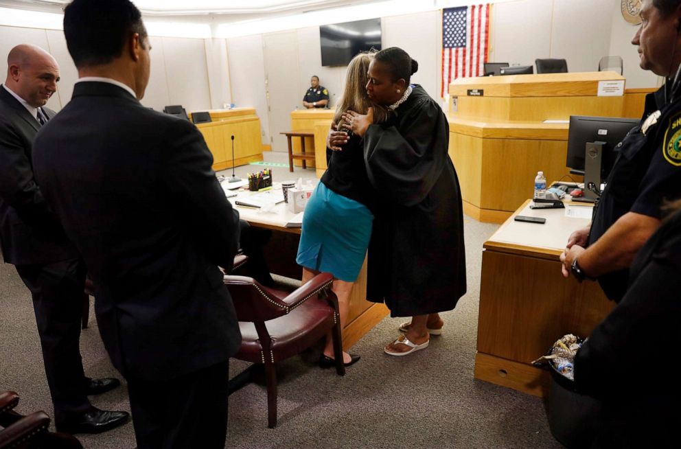 PHOTO: Former Dallas Police Officer Amber Guyger gives State District Judge Tammy Kemp a hug after the judge had given her a Bible and before Guyger left for jail, Oct. 2, 2019, in Dallas.