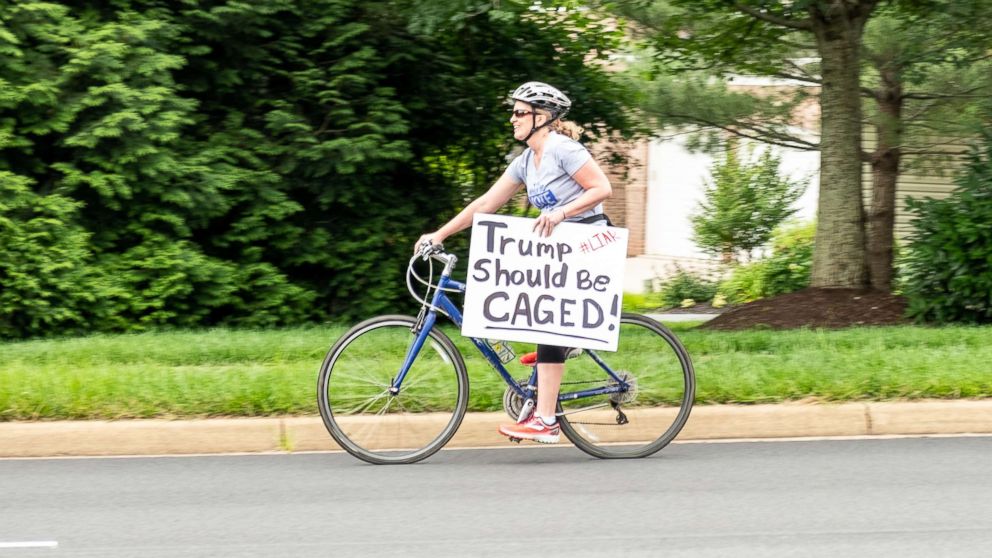 PHOTO: Juli Briskman participates in a protest against President Donald Trump in Sterling, Va., in June.