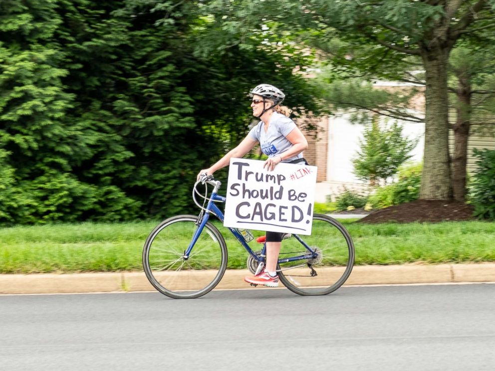 PHOTO: Juli Briskman participates in a protest against President Donald Trump in Sterling, Va., in June.