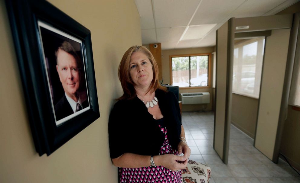 PHOTO: South Wind Women's Center executive director Julie Burkhart stands in the entryway of the Wichita, Kan., Aug. 23, 2013.