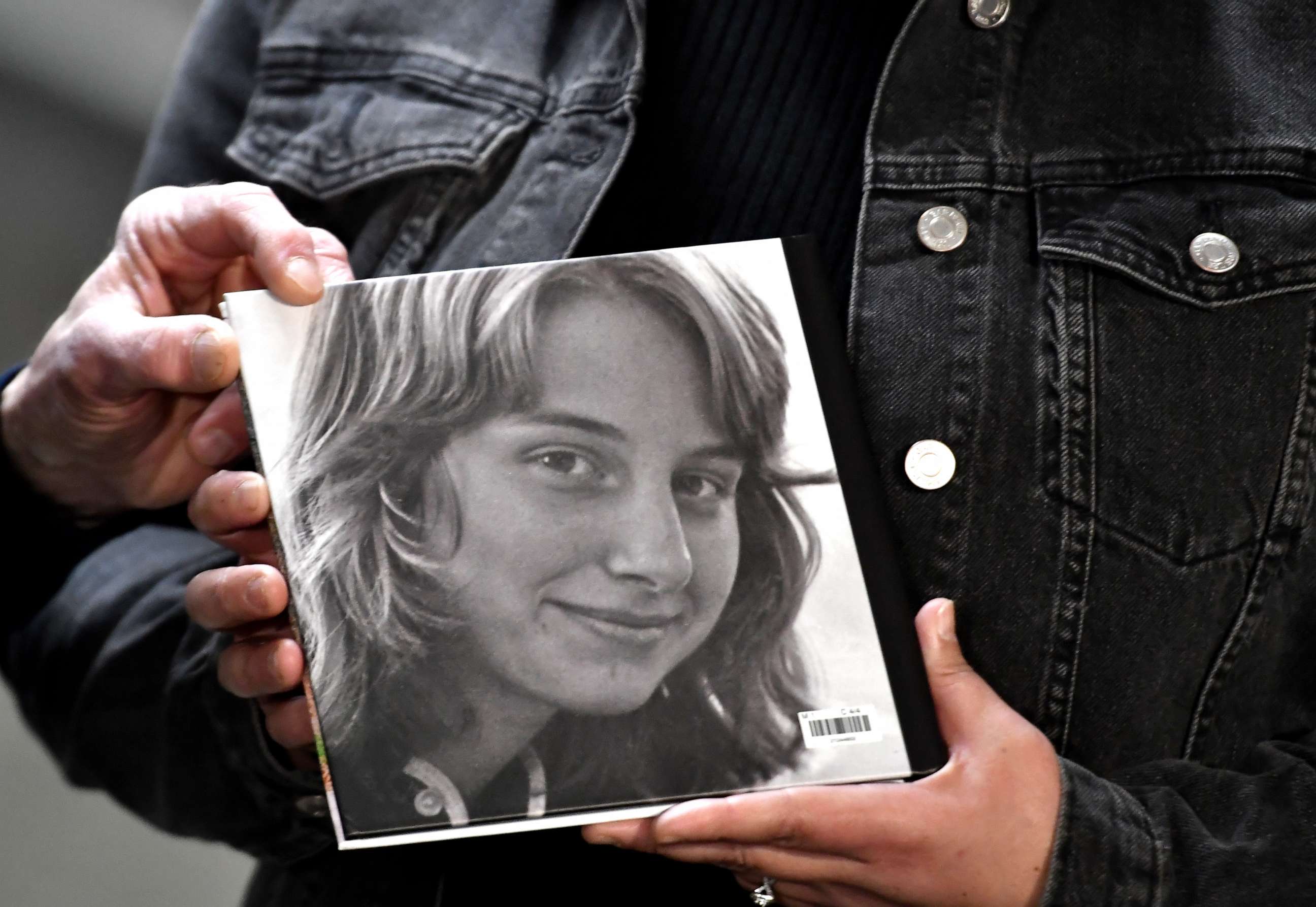 PHOTO: Larry Griffin, brother of the late Julie Jensen, holds a book showing Julie Jensen while they speak to the media as the jury deliberates in Mark Jensen's trail at Kenosha County Courthouse on Jan. 31, 2023, in Kenosha, Wis.