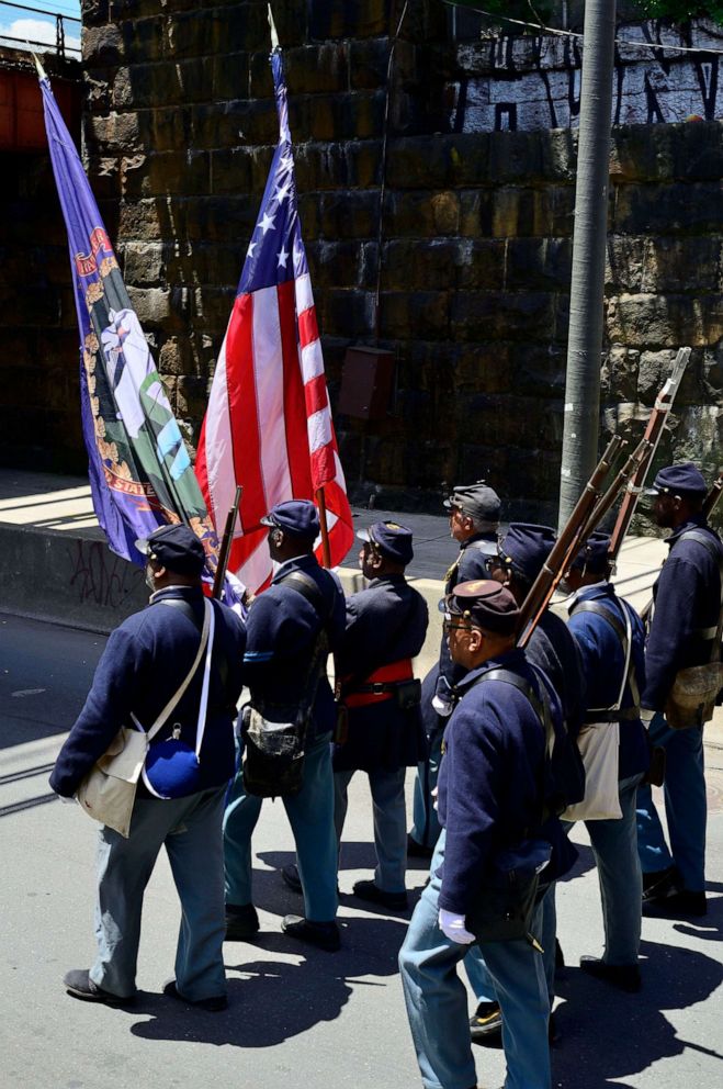 PHOTO: In this June 22, 2019, file photo, people take part in the second annual Juneteenth Parade, in Philadelphia, in the week that Juneteenth was declared an official state holiday by Gov. Tom Wolf.