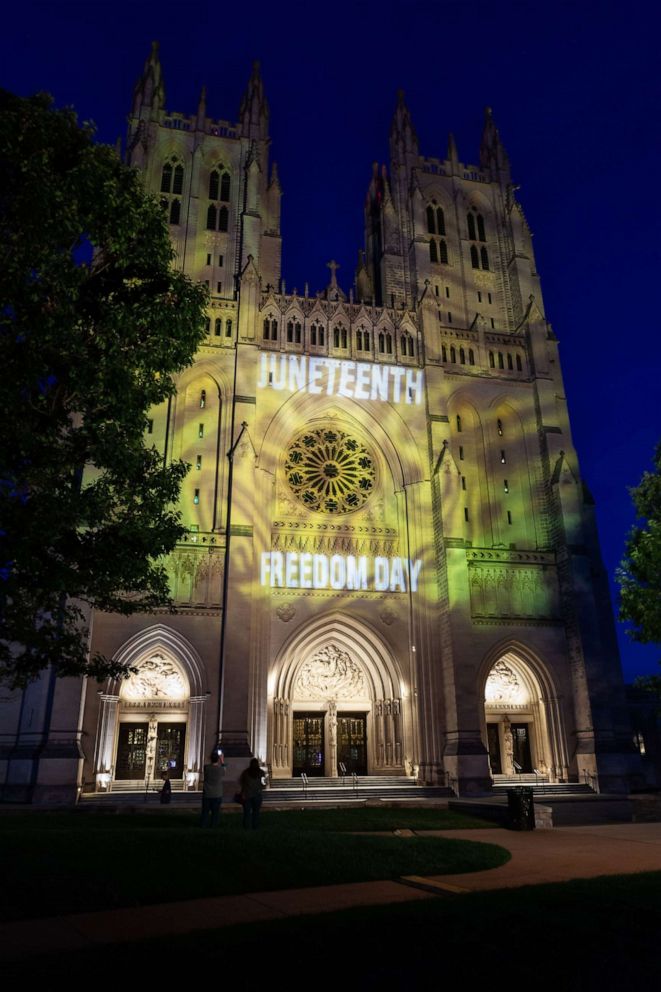 PHOTO: A lighting display is projected on the facade of the National Cathedral in honor of Juneteenth, June 16, 2021.
