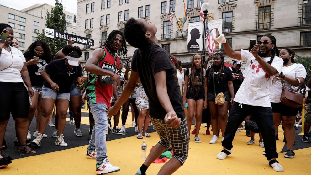 PHOTO: People celebrate Juneteenth at Black Lives Matter Plaza in Washington, D.C., June 19, 2021.