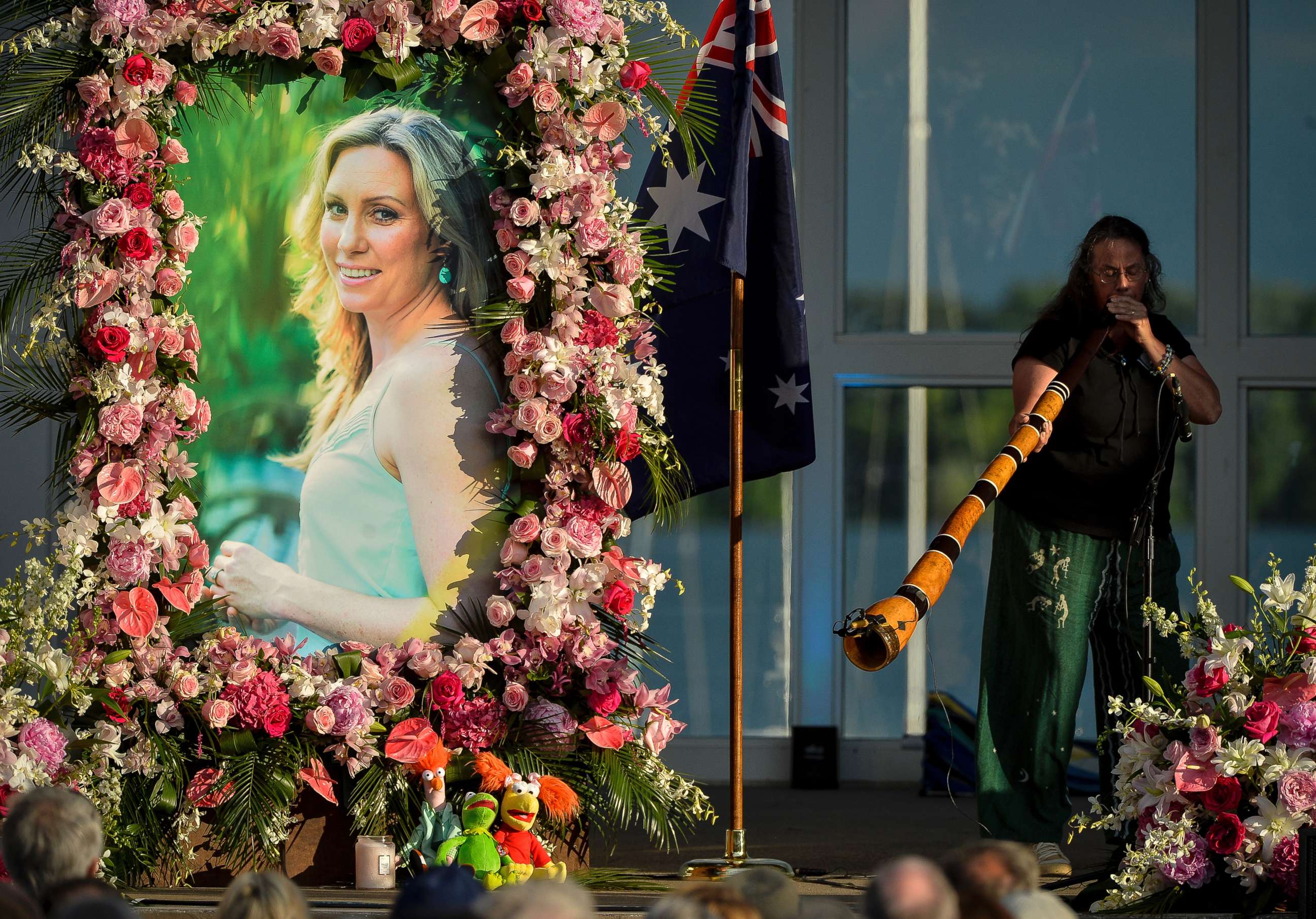 PHOTO: Johanna Morrow plays the didgeridoo during a memorial service for Justine Ruszczyk Damond at Lake Harriet in Minneapolis.