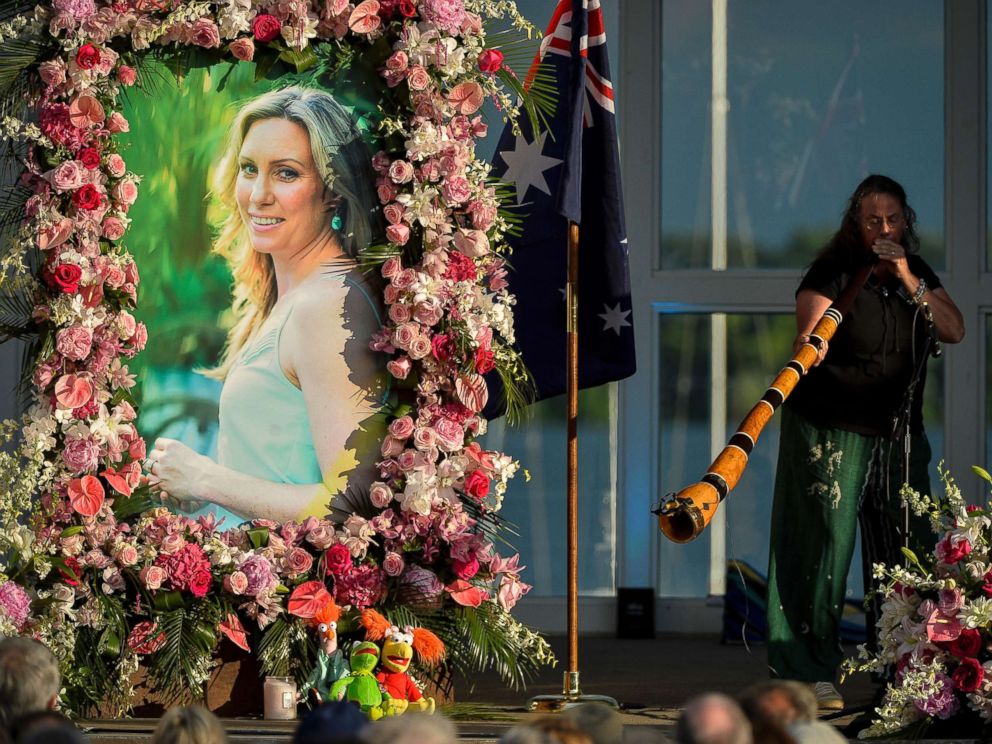 PHOTO: Johanna Morrow plays the didgeridoo during a memorial service for Justine Ruszczyk Damond at Lake Harriet in Minneapolis.