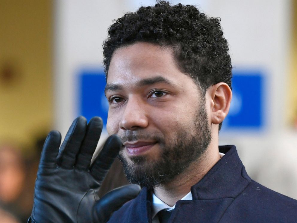 PHOTO: In this March 26, 2019, file photo, Actor Jussie Smollett smiles and waves to supporters before leaving Cook County Court after his charges were dropped in Chicago.