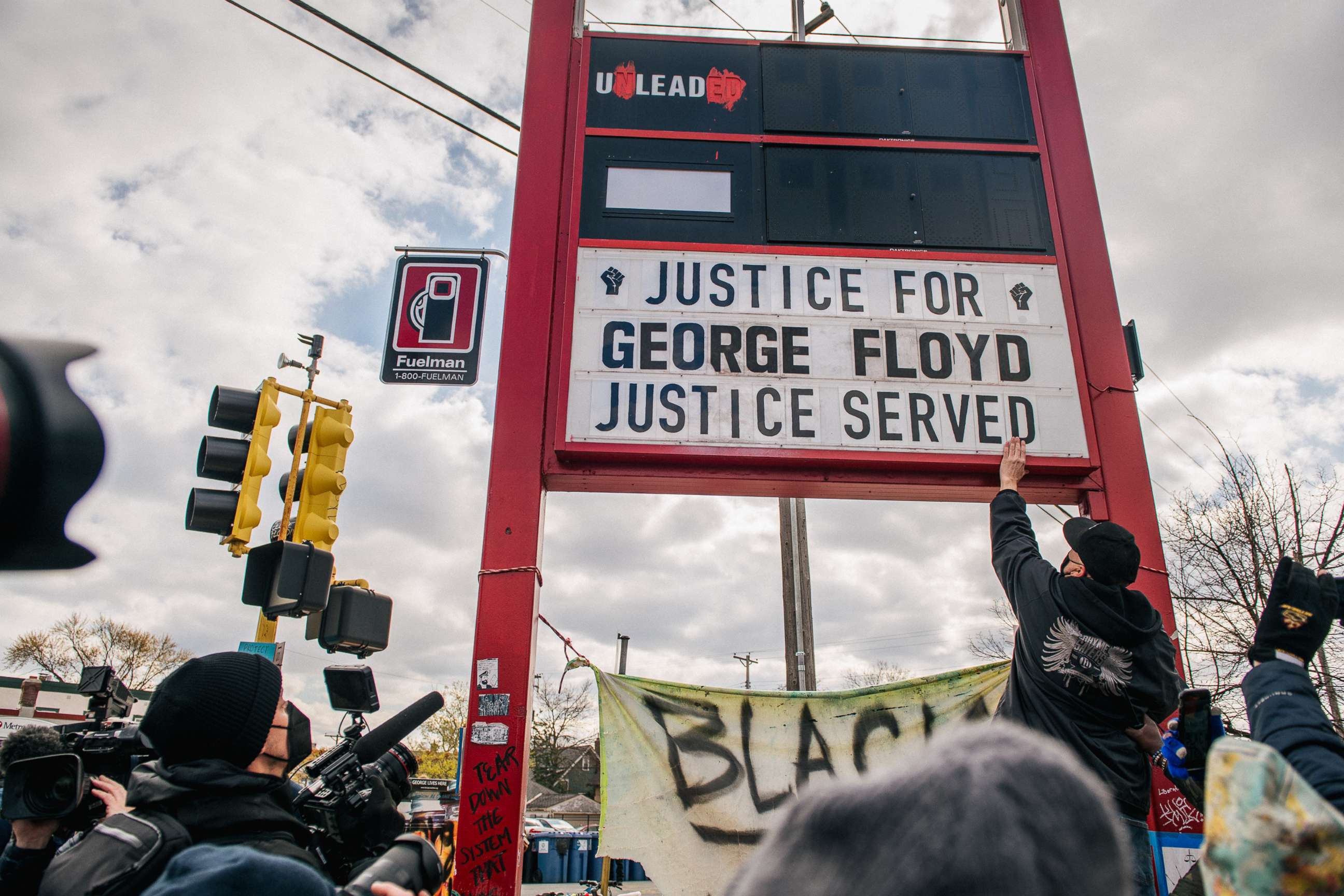PHOTO: People celebrate the guilty verdict in the Dereck Chauvin trail at the intersection of 38th Street and Chicago Avenue, April 20, 2021, in Minneapolis.