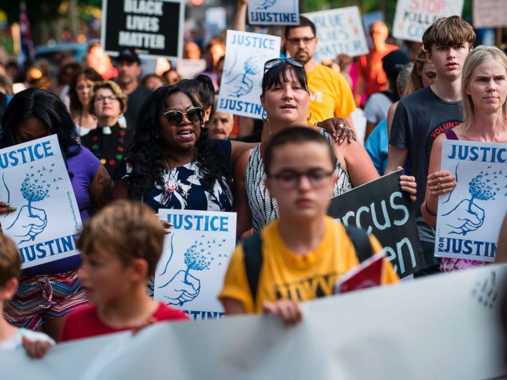 PHOTO: Valerie Castile, center, mother of Philando Castile who was killed by a police officer last year, marches in memory of Justine Damond on July 20, 2017 in Minneapolis.