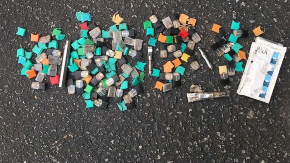 PHOTO: A photo shows cartridges from vaping devices collected by researcher Jeremiah Mock in a student parking lot in the San Francisco area in September 2019.