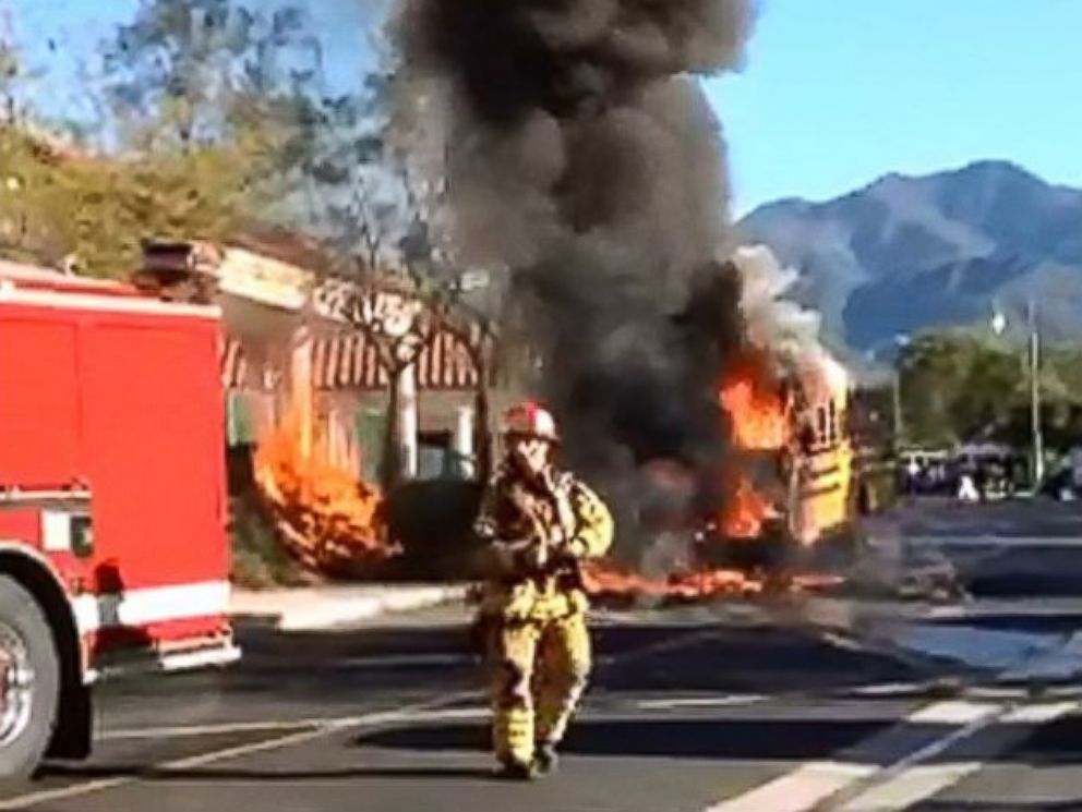 PHOTO: In this still, a school bus that caught fire is pictured outside Rancho Santa Margarita Intermediate School in Rancho Santa Margarita, Calif., March 27, 2015.
