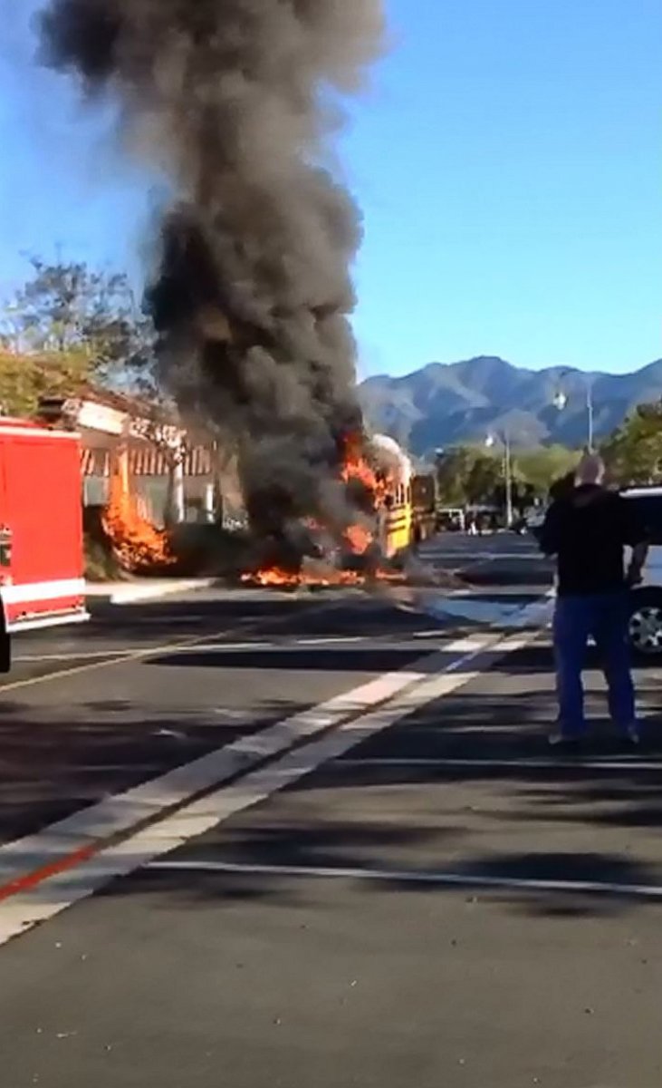 PHOTO: In this still, a school bus that caught fire is pictured outside Rancho Santa Margarita Intermediate School in Rancho Santa Margarita, Calif., March 27, 2015.
