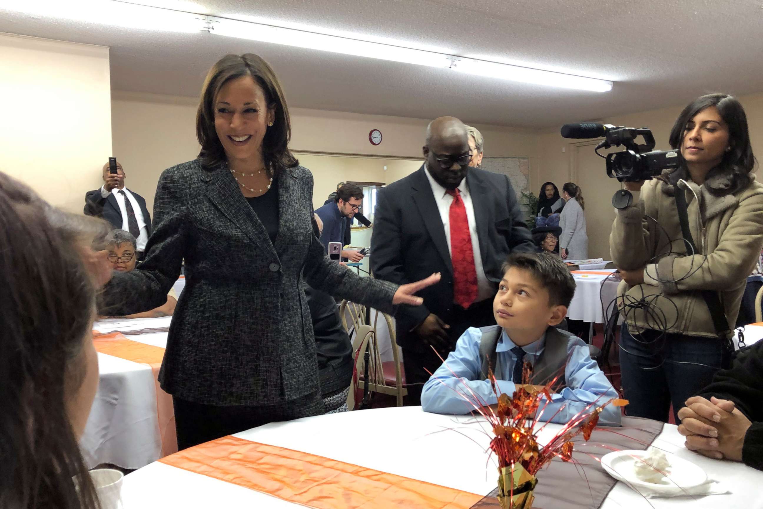 PHOTO: Democratic presidential candidate Sen. Kamala Harris, D-Calif., speaks to Aaron Nachampassak, 11, right and others at a church congregation breakfast in Fort Dodge, Iowa, on Nov. 10, 2019. 