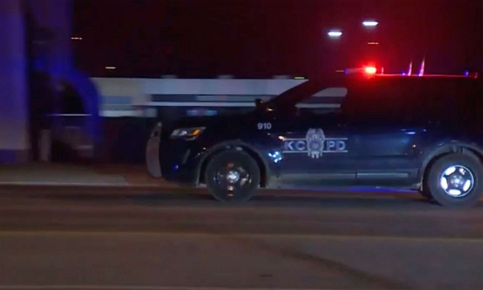 PHOTO: In this image made from video, a police vehicle passes with sirens near the scene of a shooting, Jan. 20, 2020, in Kansas City, Mo. Police say at least two people are dead and a dozen people may have been injured in a shooting outside a bar.