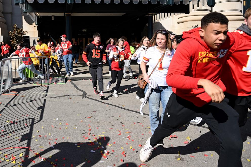 PHOTO: People flee after shots were fired near the Kansas City Chiefs' Super Bowl LVIII victory parade on February 14, 2024, in Kansas City, Missouri.