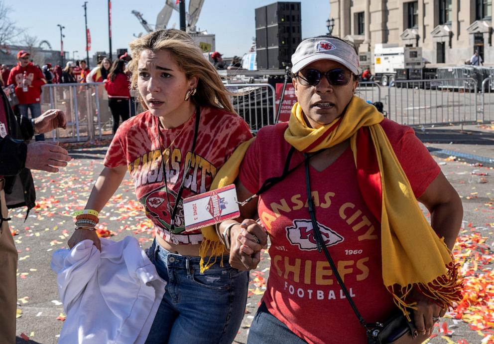 PHOTO: People flee after shots were fired near the Kansas City Chiefs' Super Bowl LVIII victory parade on February 14, 2024, in Kansas City, Missouri.