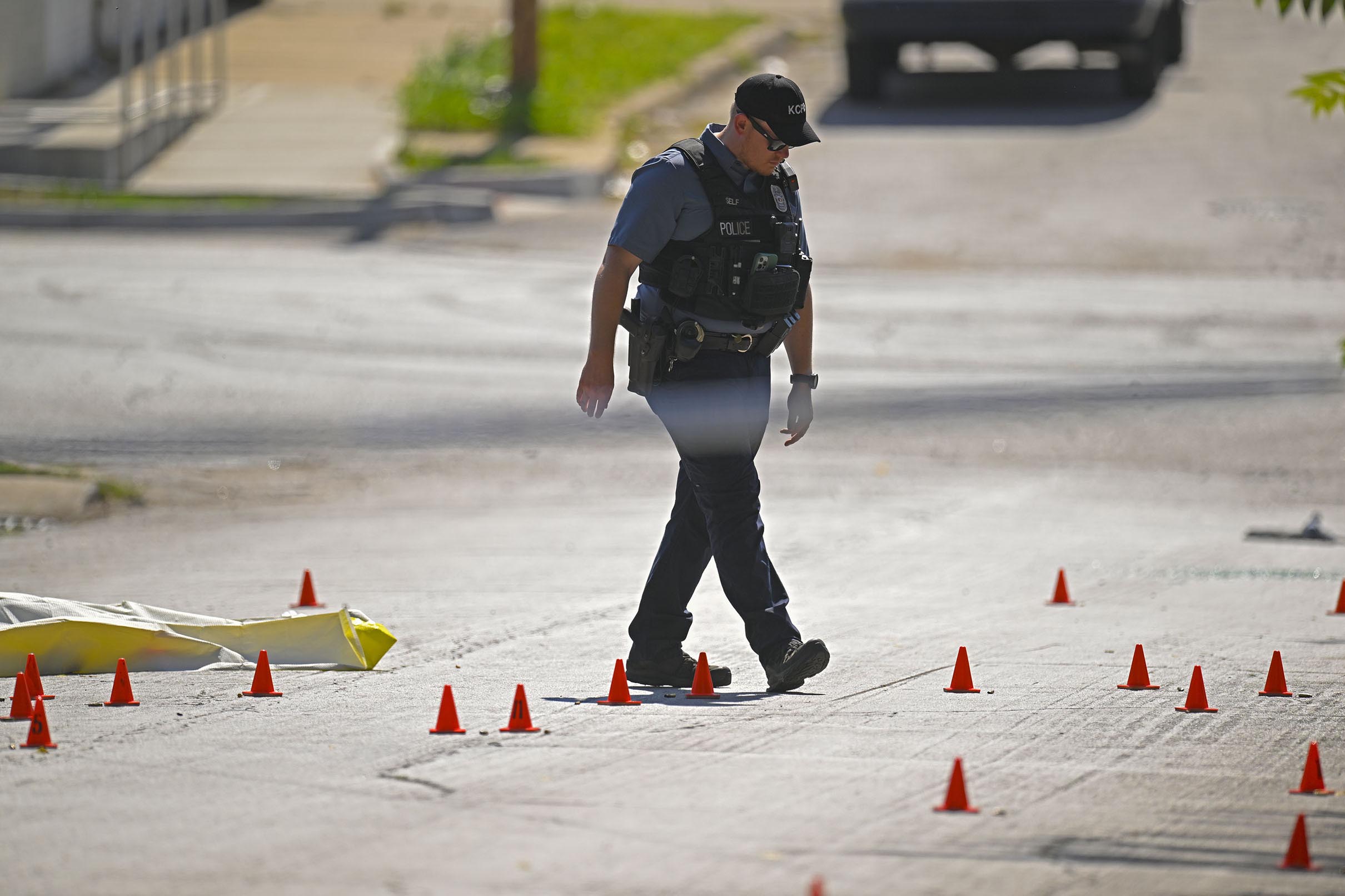 PHOTO: Evidence markers filled the street as police were investigating the scene following a shooting on June 25, 2023 in Kansas City.