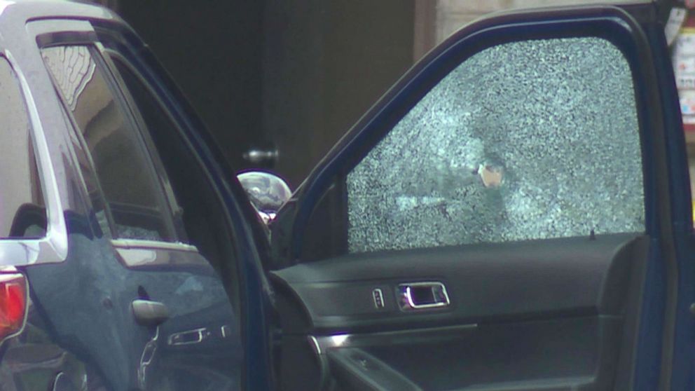 PHOTO: A bullet hole in a car window at the scene in Kansas City, Mo., July 15, 2018, after several police officers were involved in a shoot-out with a suspect and three officers suffered gun-shot wounds.