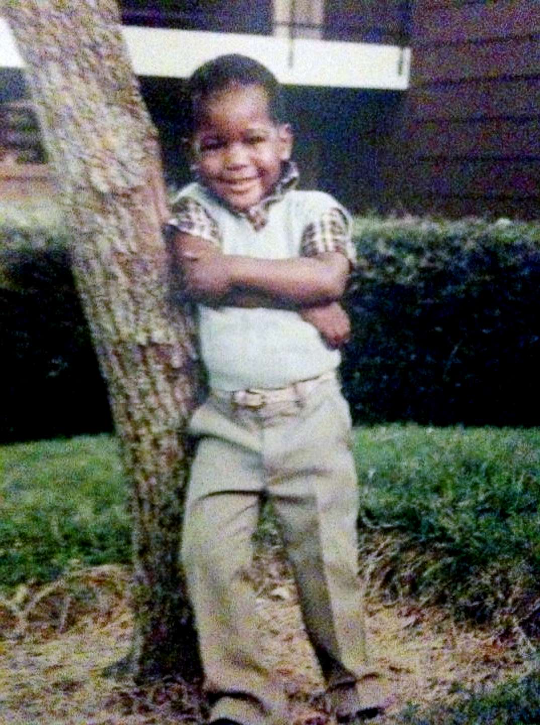 PHOTO: Young Karamo Brown poses in front of his house. "I was a very happy child."