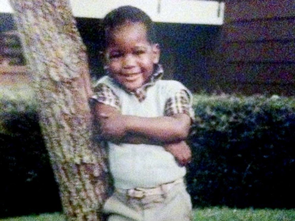 PHOTO: Young Karamo Brown poses in front of his house. I was a very happy child.