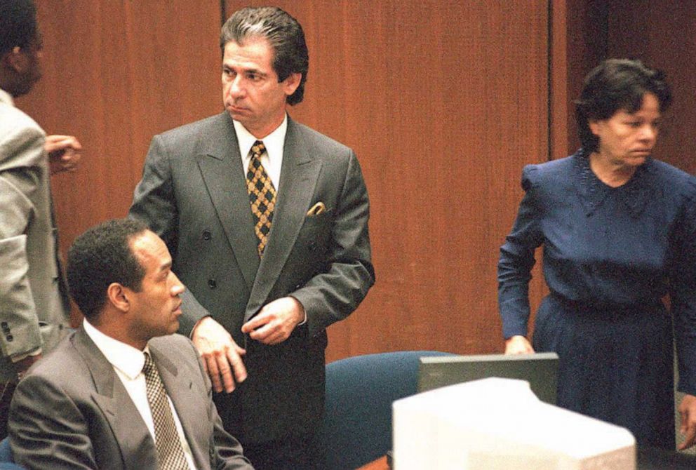 PHOTO: Robert Kardashian stands next to O.J. Simpson as he watches defense witness Rosa Lopez enter the court, Feb. 27, 1995, in Los Angeles. 