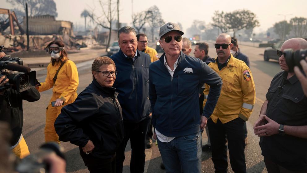 PHOTO: California Governor Gavin Newsom and Los Angeles Mayor Karen Bass tour the downtown business district of Pacific Palisades as the Palisades Fire continues to burn on Jan. 8, 2025 in Los Angeles.