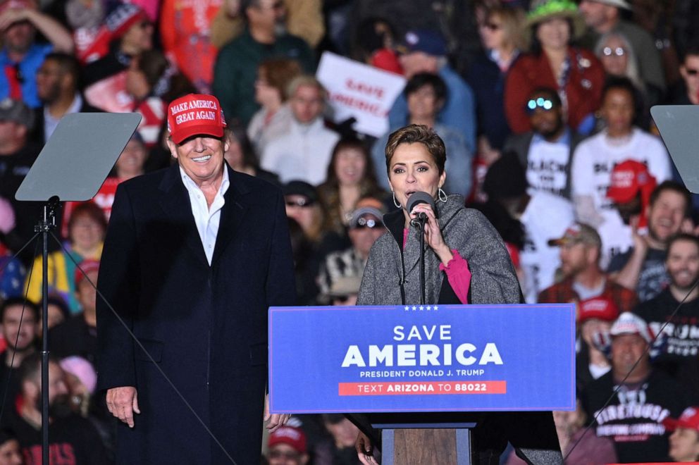 PHOTO: In this file photo taken on Jan. 15, 2022,  former President Donald Trump and Kari Lake, whom Trump is supporting in the Arizona's gubernatorial race, speak during a rally at the Canyon Moon Ranch festival grounds in Florence, Arizona.