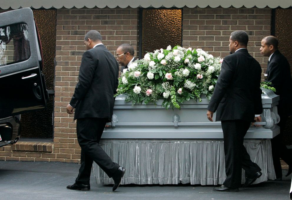 PHOTO: Pallbearers bring out the casket of Kathryn Johnston after her funeral service, Nov. 28, 2006 in East Point, Ga.