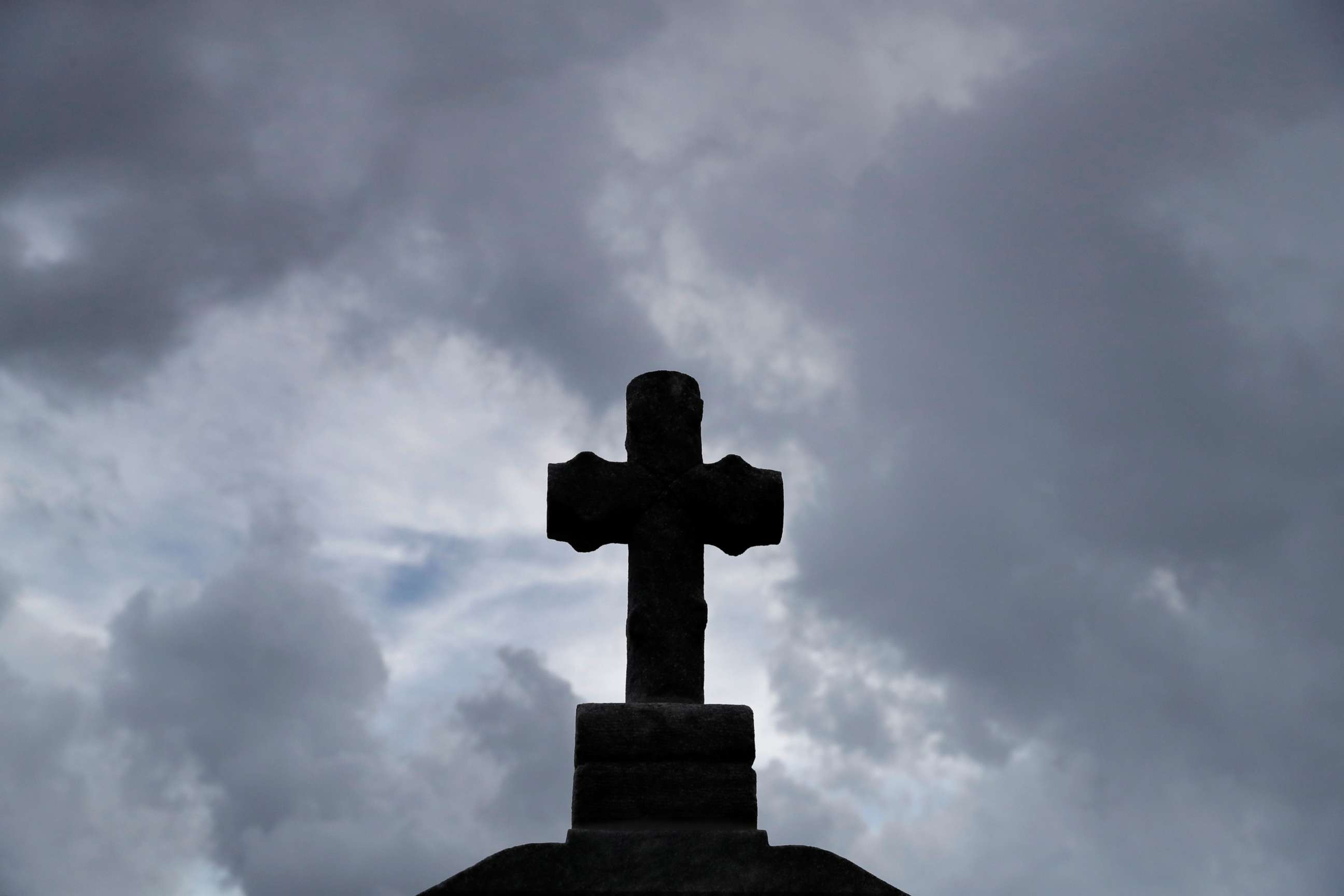 PHOTO: A cross sits atop an elevated headstone at Gates of Prayer cemetery in Louisiana on Aug. 28, 2020. Saturday marks the 15th anniversary of Hurricane Katrina in New Orleans.