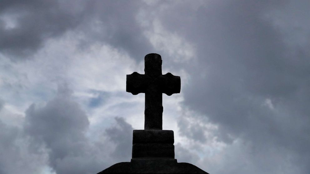 PHOTO: A cross sits atop an elevated headstone at Gates of Prayer cemetery in Louisiana on Aug. 28, 2020. Saturday marks the 15th anniversary of Hurricane Katrina in New Orleans.