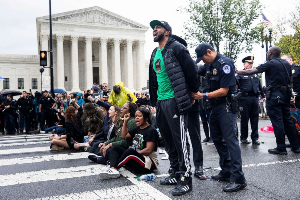 PHOTO: Protesters are arrested outside the U.S. Supreme Court building as Brett Kavanaugh and Christine Blasey Ford testify on Capitol Hill, Sept. 27, 2018, in Washington, DC.