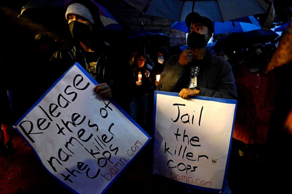 PHOTO: People hold up signs asking for the release of the LAPD officers names that were involved and for them to be jailed during a vigil in Los Angeles, Jan. 14, 2023, for Keenan Anderson who went into cardiac arrest and died after LA police tased him.