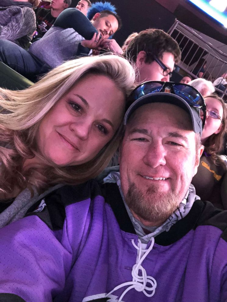 PHOTO: Keith Alexander, 55, and his wife are seen smiling at a hockey game on Jan. 19. The father of four had recently undergone surgery to remove a mass on his colon and will be going under the knife again to remove lesions on his liver. 