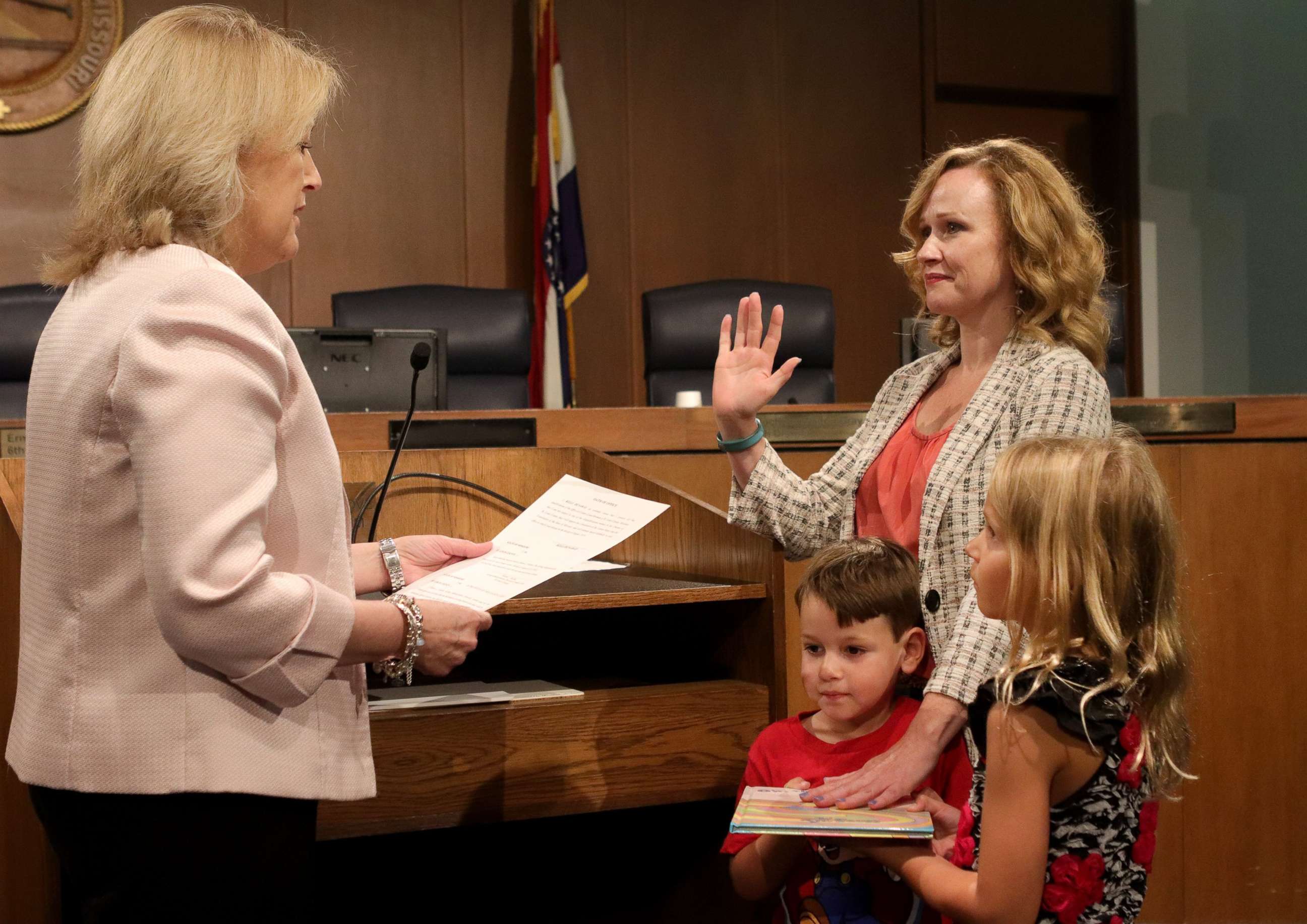 PHOTO: Kelli Dunaway, right, gets sworn in as a new St. Louis County councilwoman by Diann Valenti, left, acting county council clerk. It is not required to be sworn in on a bible and Dunaway chose to use the Dr. Seuss book, "Oh, The Places You'll Go!"