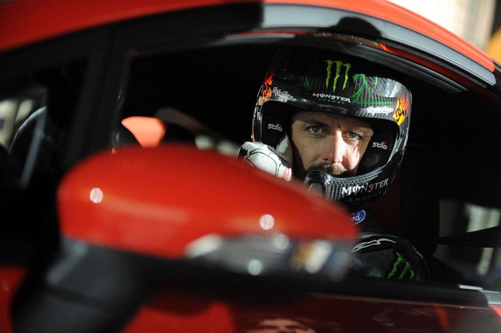 PHOTO: (FILES) In this file photo taken on March 24, 2013, US driver Ken Block of Hoonigan Racing Division Team, formerly known as the Monster World Rally Team, poses for a photo in a Ford Fiesta ST type car on ice of Budapest City Park Ice Rink.