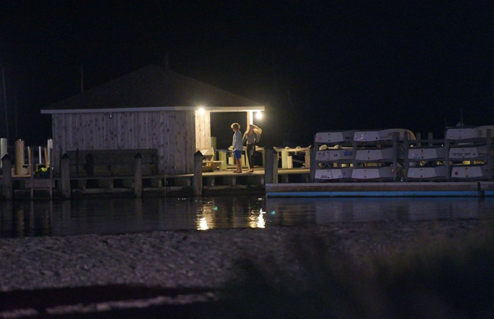 PHOTO: People walk down the dock at the Hyannis Port Yacht Club by the Kennedy Compound where police are investigating the death of Saoirse Kennedy Hill, the granddaughter of the late Robert F. Kennedy, in Hyannis Port, Mass., Aug. 1, 2019.