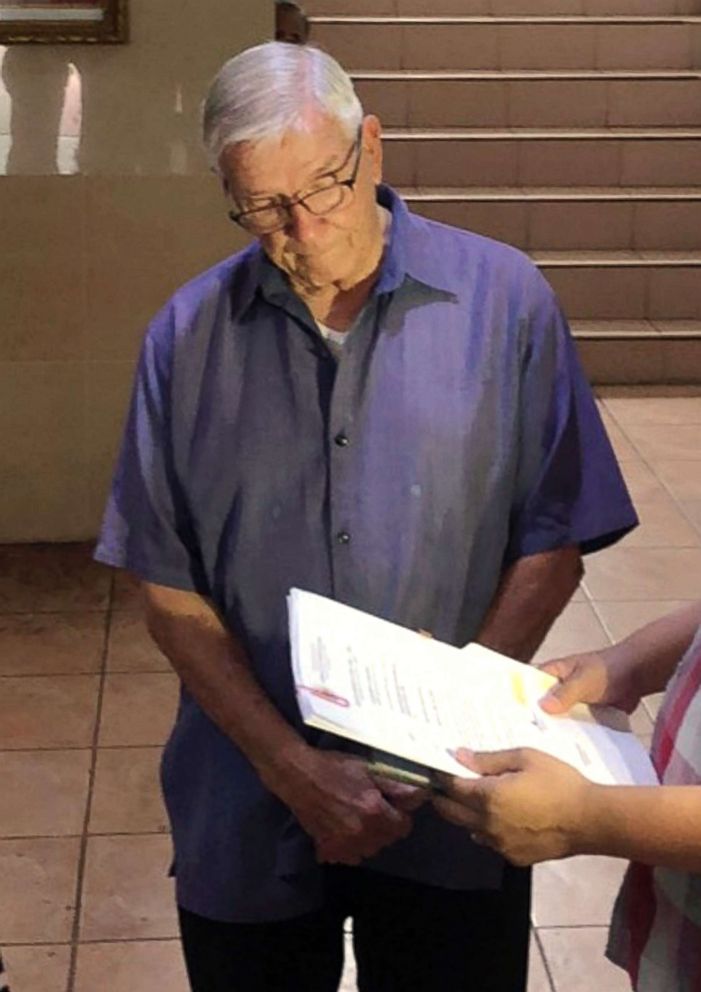 PHOTO: In this Dec. 5, 2018, photo American Roman Catholic priest Rev. Kenneth Bernard Hendricks looks at documents after being arrested in a church in Naval town in the island province of Biliran, central Philippines.