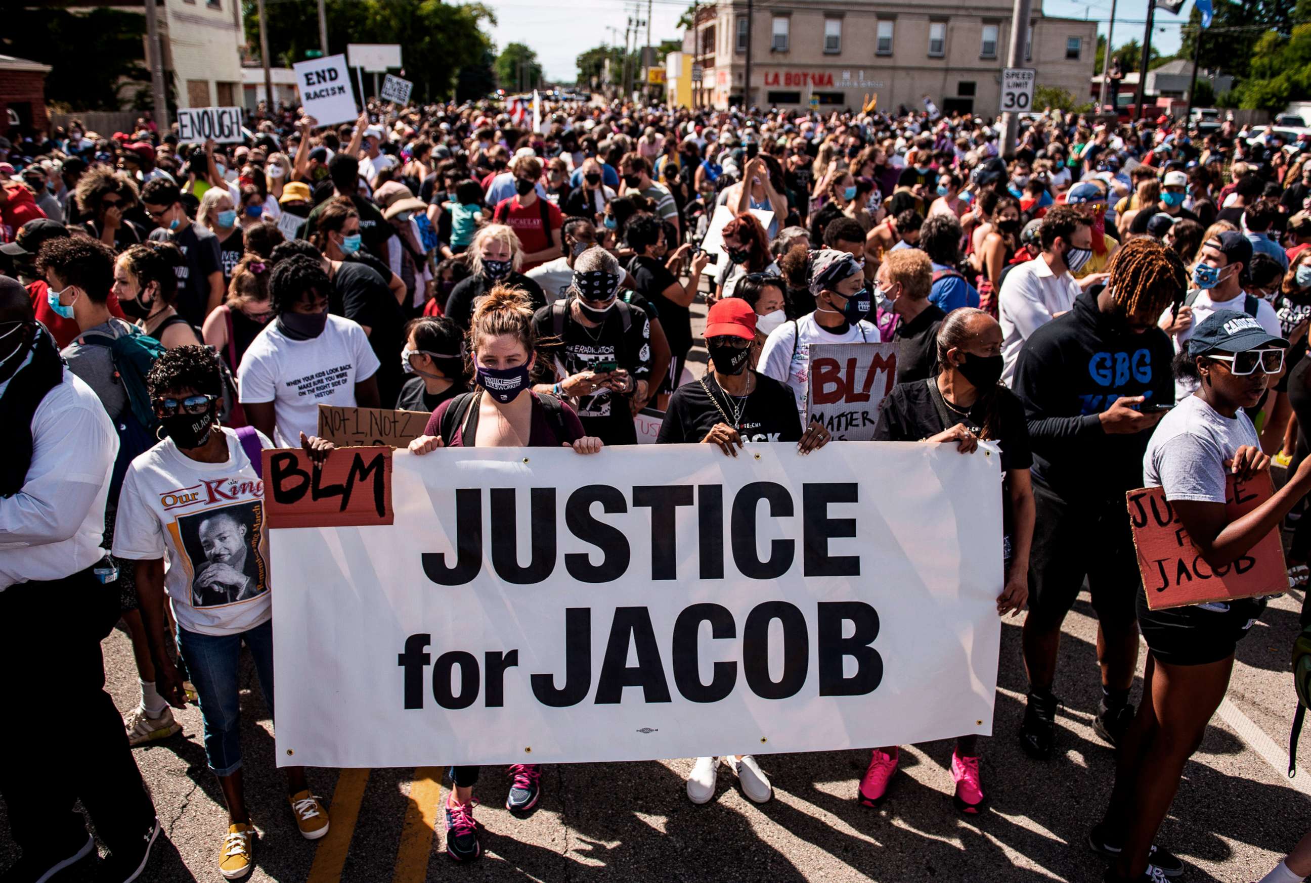 PHOTO: Protesters march with the family of Jacob Blake during a rally against racism and police brutality in Kenosha, Wis., Aug. 29, 2020. 
