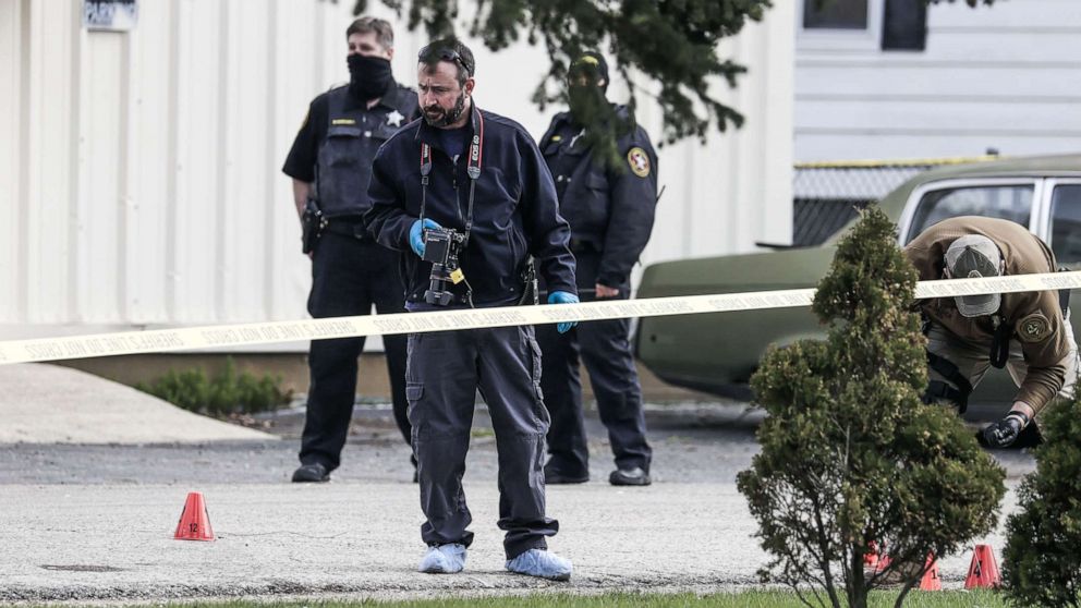 PHOTO: Law enforcement investigate the Somers House bar where a shooting occurred in the early morning, April 18, 2021, in Kenosha Wisconsin.